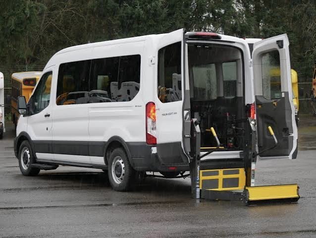 Ford E-Transit accessible van with powered wheelchair lift deployed